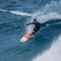 man surfing on sea waves